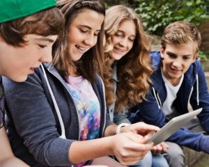 16 Jul 2012 --- teens using tablet pc --- Image by © Daniel Koebe/Corbis