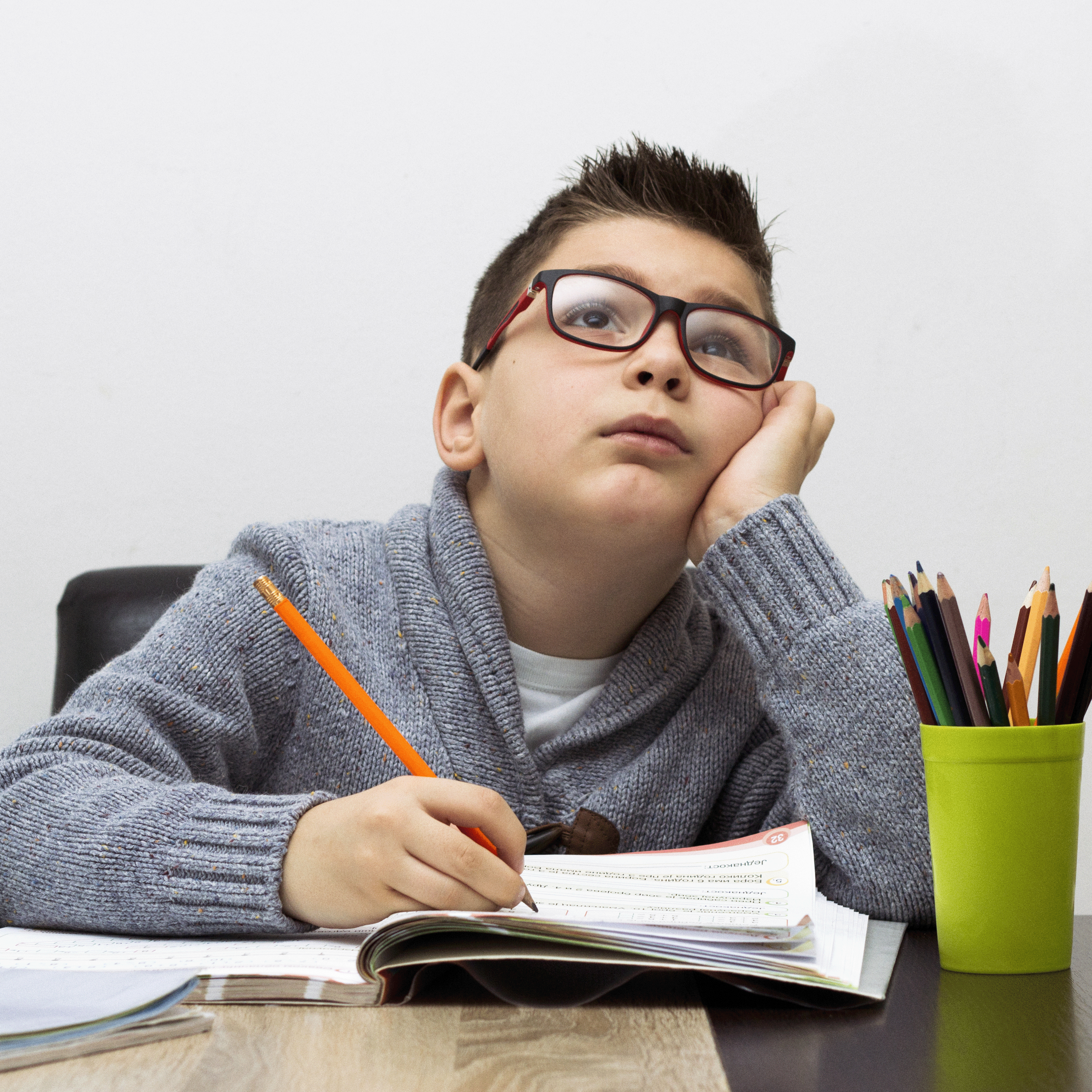 young-boy-frustrated-homework-writing-home-boy-studying-table-kid-drawing-with-pencil
