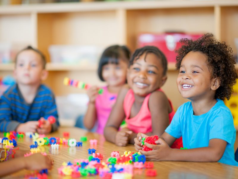 A diverse group of preschoolers in a classroom