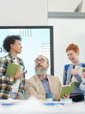 group-of-kids-talking-to-teacher-in-school.jpg
