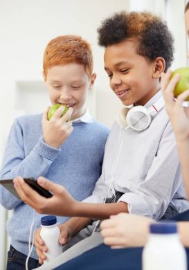 school-children-using-phone-at-school.jpg