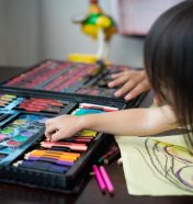 toddler-choosing-colours-while-drawing-on-a-paper-at-home-.jpg